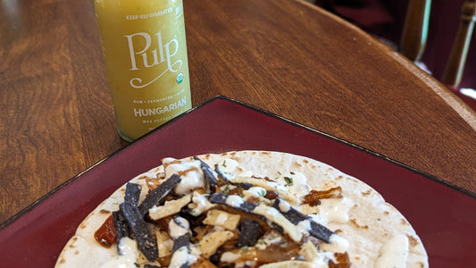 An image of a taco drizzled with Pulp-infused Hungarian Wax Pepper ranch sauce