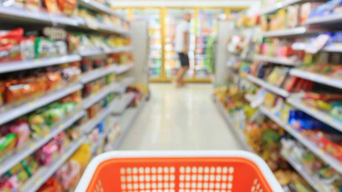 A Shopping Cart rolling down a grocery aisle at Target.